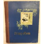 A vintage stamp album containing world stamps.