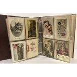 A folder containing 130+ vintage Christmas, Easter, birthday and greeting cards.