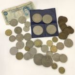 A collection of assorted British and foreign bank notes and coins.
