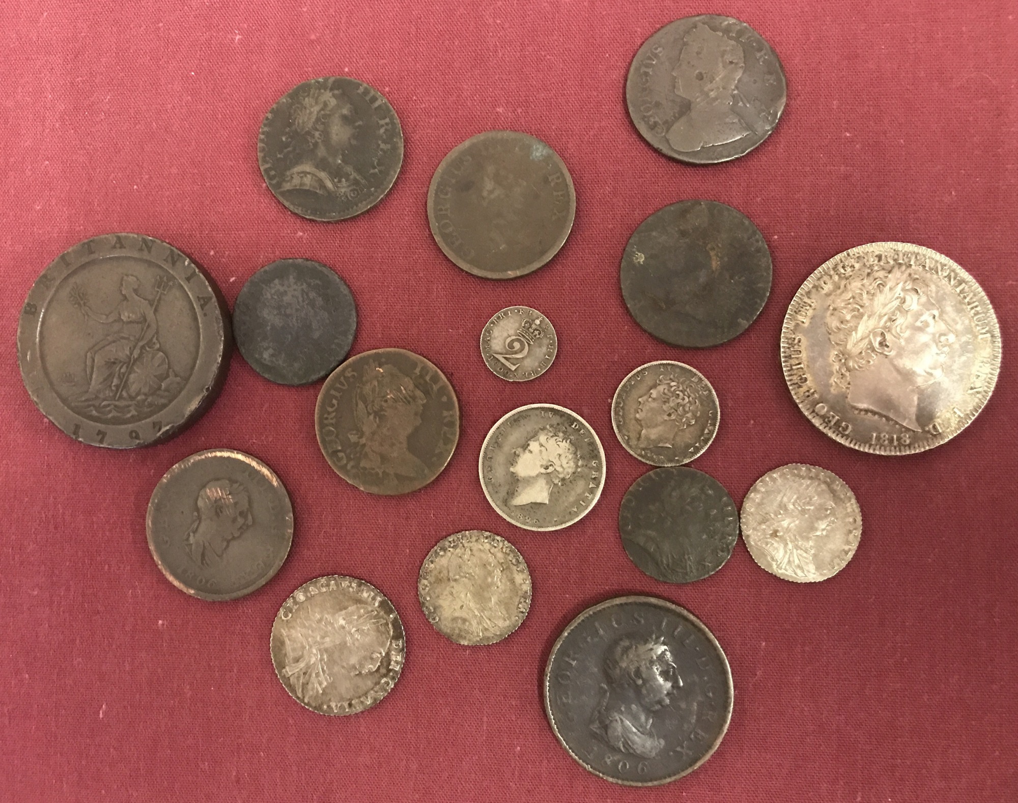 A collection of George III and George IV coins.