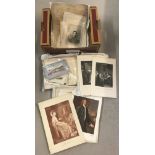 A box of antique and vintage engravings and prints.