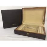 A boxed red Birdseye maple jewellery box by Walwood.