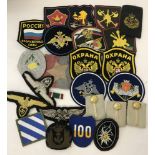 Bag of original and reproduction cloth military badges.