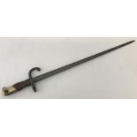An antique French Gras M1874 T-section bayonet with engraved blade, dated 1878.