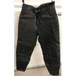 A pair of " Ashman" black leather padded motorcycle trousers.