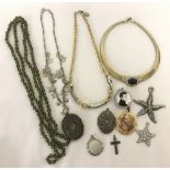A small collection of vintage and modern necklaces and pendants.