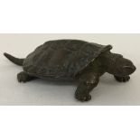 A small Japanese bronze figure of a tortoise.