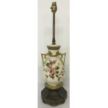 Hand decorated and gilded ceramic table lamp with pierced work handles.
