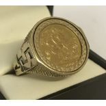An Elizabeth II full sovereign, dated 2000, set in a 9ct gold men's ring.