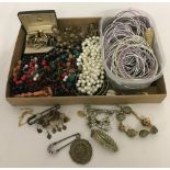 A box of vintage and modern costume jewellery and men's cufflinks.