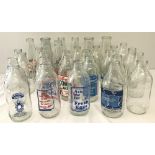 A box of 30 vintage advertising milk bottles.