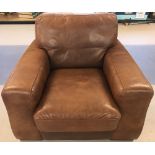 A large modern design Sofitallia armchair in tan leather with wooden feet.