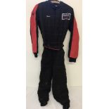 An RSS child's Go Kart all-in-one racing suit in black and red, with Tommy Motorsports Badge.