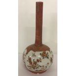 A small oriental vase with floral and bird decoration.