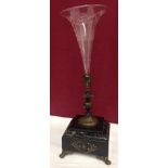 An etched clear glass Victorian trumpet vase in decorative spelter stem mounted on a marble base.
