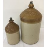 2 stoneware bottles with local advertising.