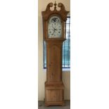 A modern pine cased grandfather clock with quartz movement.