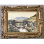 A gilt framed and glazed water colour of a Welsh hill and river scene by Arthur.E.Davies.