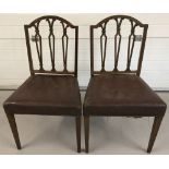 A pair of Georgian dark wood framed dining chairs with leather effect studded seats.