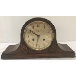 A 1930's Bravington Ltd, Napoleons hat shaped, oak cased mantle clock.