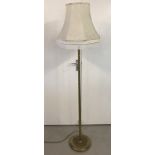 A vintage brass standard lamp together with a cream octagonal lampshade.