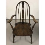 An antique dark oak Farmhouse chair with central carved panel to back.