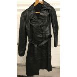 A vintage ladies full length black leather trench coat, belted with front button fastening.