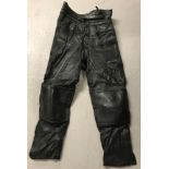 A pair of "Akito Mercury Plus" black leather motorcycle trousers.