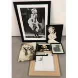 4 framed and glazed Marilyn Monroe pictures together with a book and a mirror.