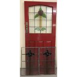 A 1930's leaded glass door, painted red, with 2 matching leaded glass window panels.