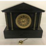 An antique slate mantle clock with pendulum by Ansonia Clock Co, New York.