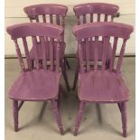 A set of 4 vintage pine slat back kitchen chairs, painted purple.