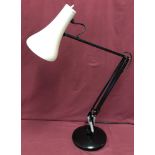An large original 'Anglepoise' lamp with black frame and base and white metal shade.