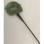 A vintage decorative pierced work, jade hat pin, depicting a goat.