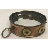A Victorian copper and brass dog collar.
