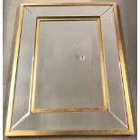 A large modern gilt framed 5 sectional mirror with bevel edged panels.
