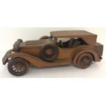 A 'Wooden Art' model of a car from the "Classic Car Collection".