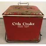 A vintage fibreglass insulated, painted metal Cola cooler.