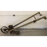 A vintage American "Planet Junior No 4" push seed drill.