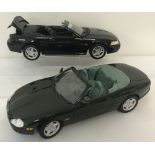 2 unboxed diecast Maisto cars, 1:18 scale.