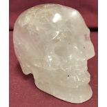 A carved rock crystal ornament in the shape of a skull.