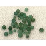 A collection of 37 small round cut South Columbian emerald's for jewellery making.