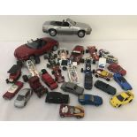 A tray of assorted play worn diecast vehicles in a variety of scales.