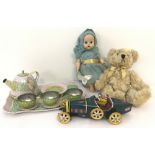 A collection of vintage toys. A vintage tinplate model car and teaset.