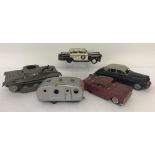 4 vintage tin plate vehicles together with a clockwork car.
