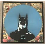 A framed and glazed vinyl record painted with Batman design.
