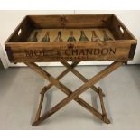 A wooden 2 handled champagne butlers tray.