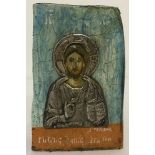 A painted wooden Russian Icon mounted with white metal.