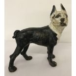 A vintage painted, heavy cast iron figurine of a French Bulldog.
