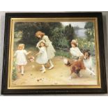 A vintage oak framed signed print of children playing with a dog .